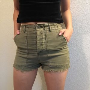 Short green high waisted cut offs